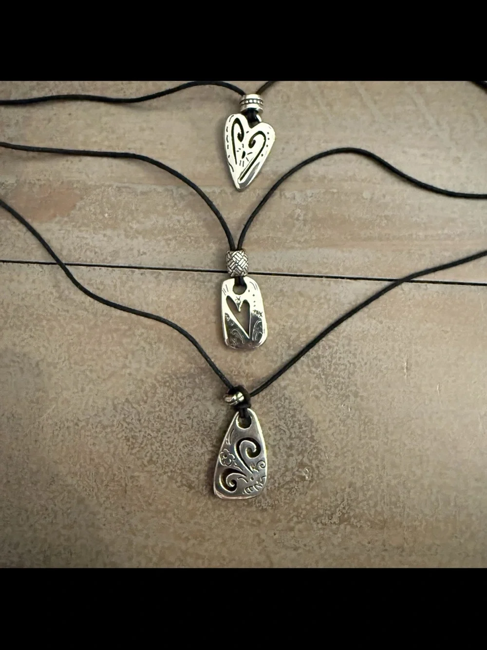 Brighton Brazilian Black multi charm triple strand leather cord necklace